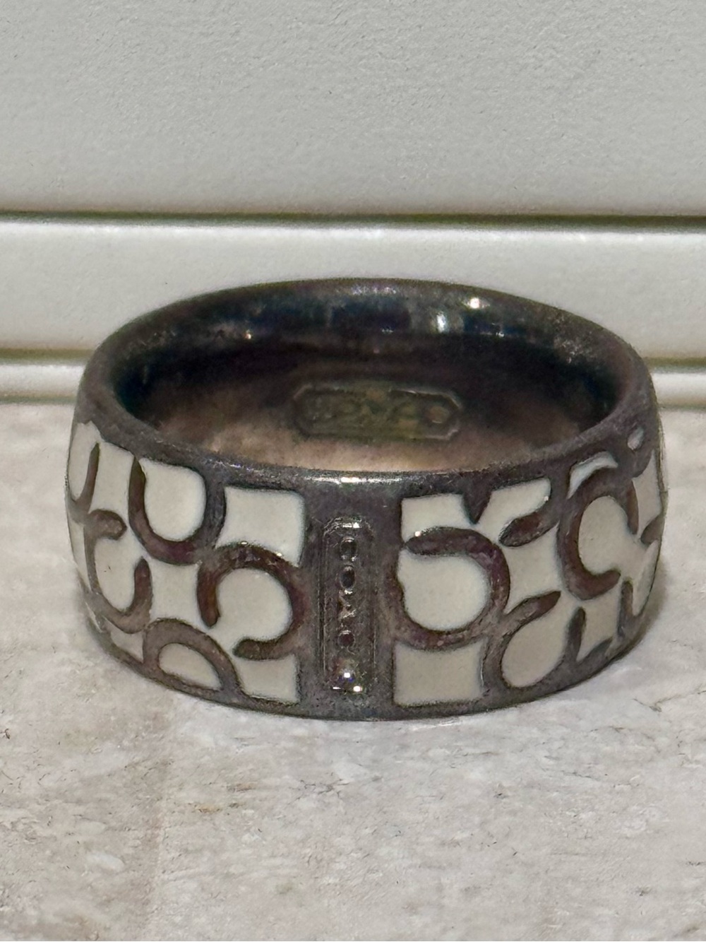 Silver-Tone Ring with White Enamel Signature Pattern